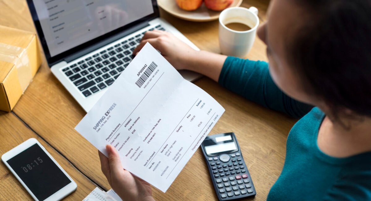 Woman checking shipping letter